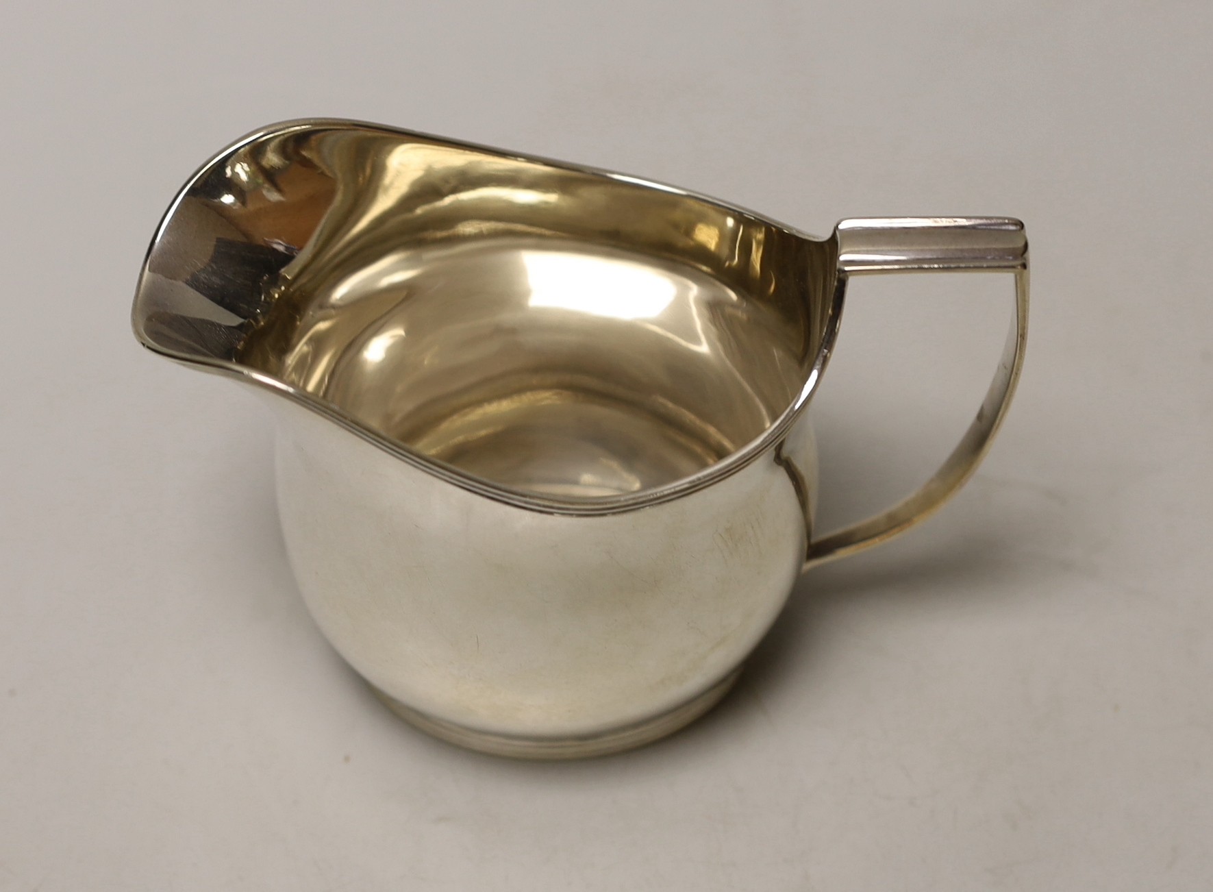 A George III silver helmet shaped cream jug, London, 1810, 10cm, 5.8oz.